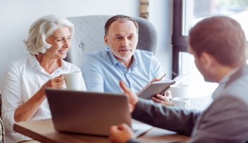 Financial advisor meeting clients in Spain